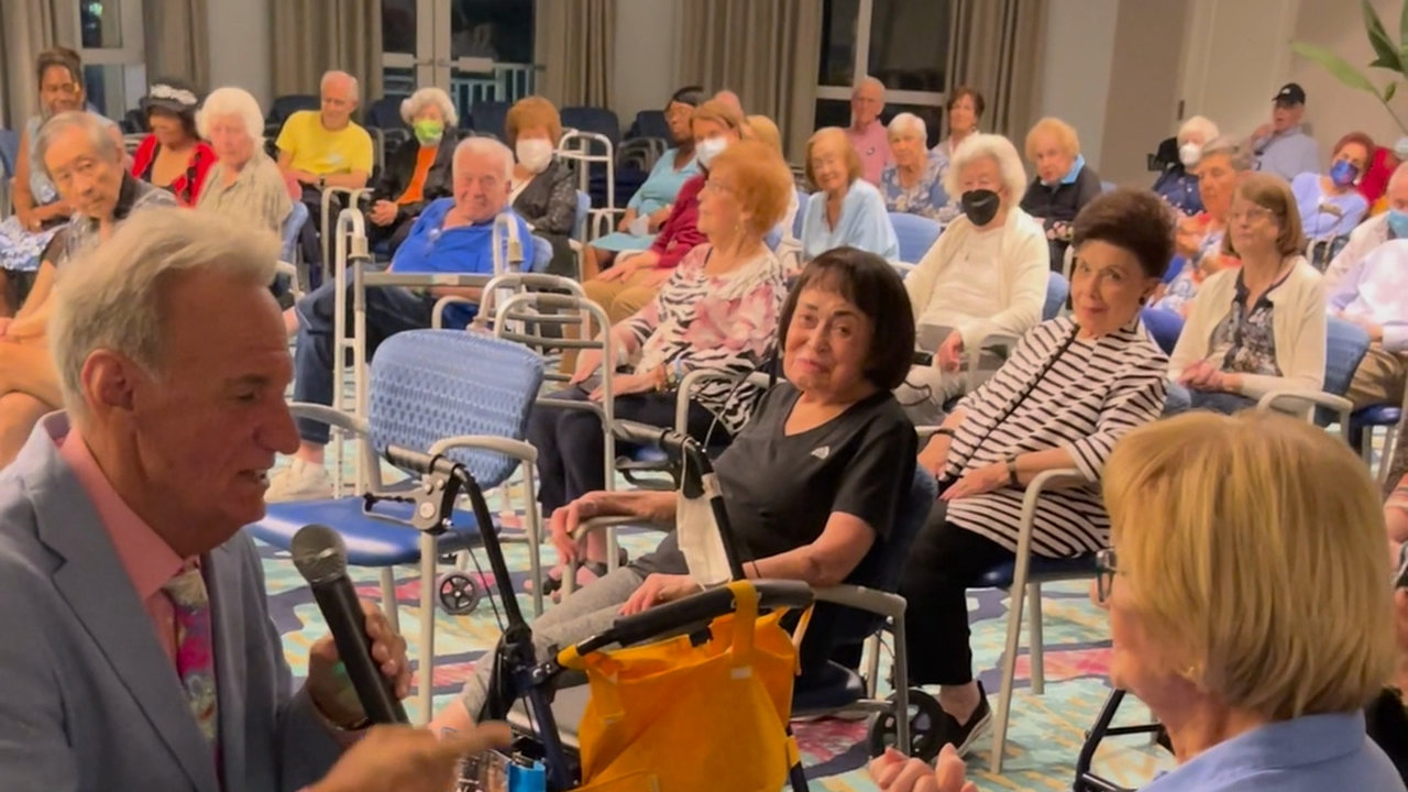 Alan singing with Doc at a senior community performance